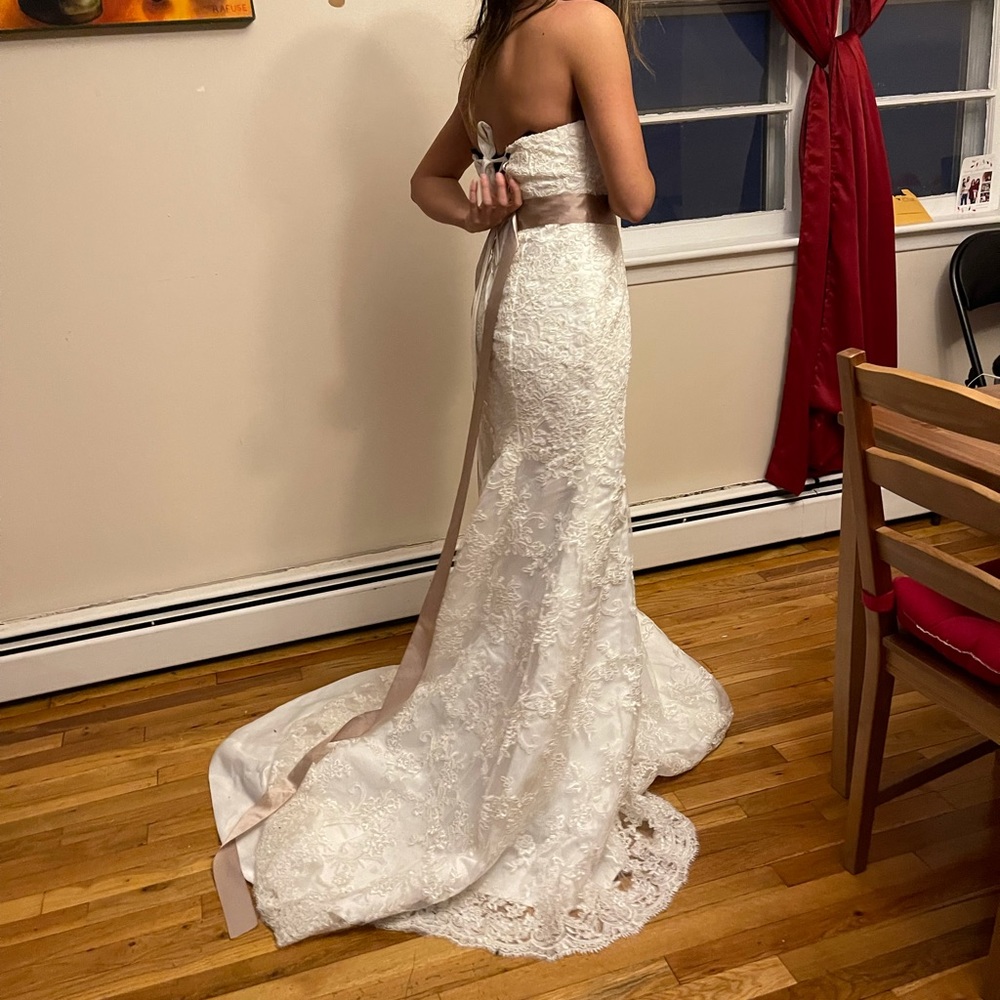 Brand new wedding dress with its tag